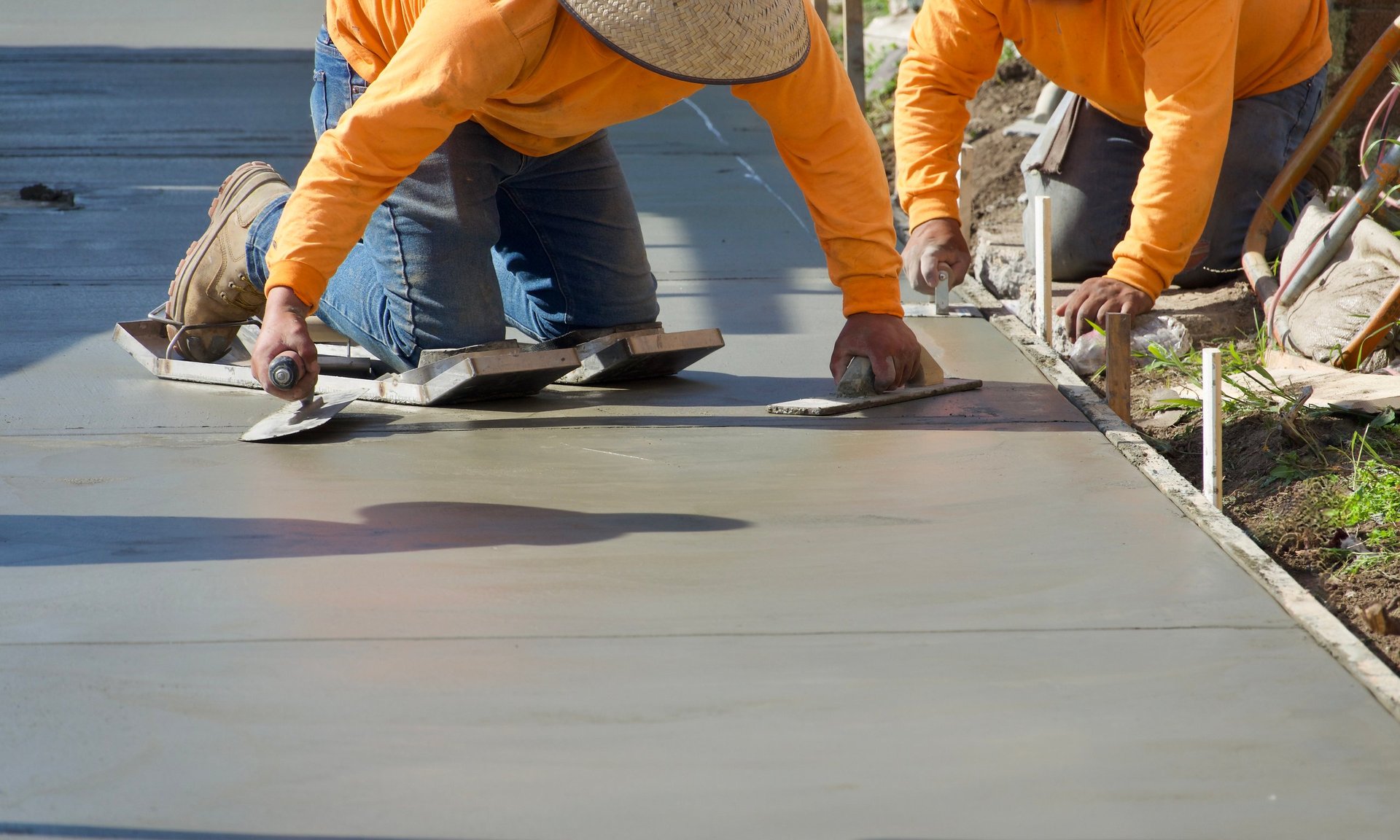 Construction workers finishing concrete work